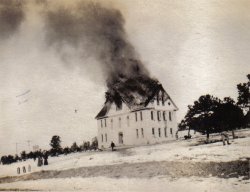 Every December 12 my grandmother would pull out the family album and we'd look at the picture of the Crawford Colorado school house that burned 12-12-12.

They heard the fire bell and all ran to where the smoke was.  She said "T'weren't nothin' to do but take pictures" and that's just what they did.